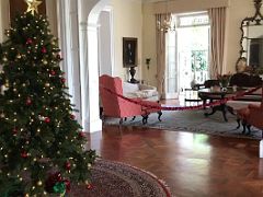 04A Christmas tree in the main entry hall with the living room Devon House mansion Kingston Jamaica